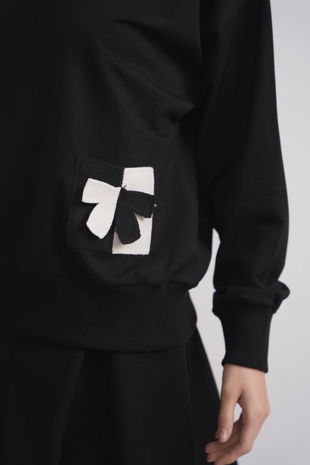 Gestricktes Taschen-Sweatshirt